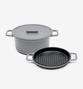 Gray cast iron Dutch oven with lid and nonstick grill pan set