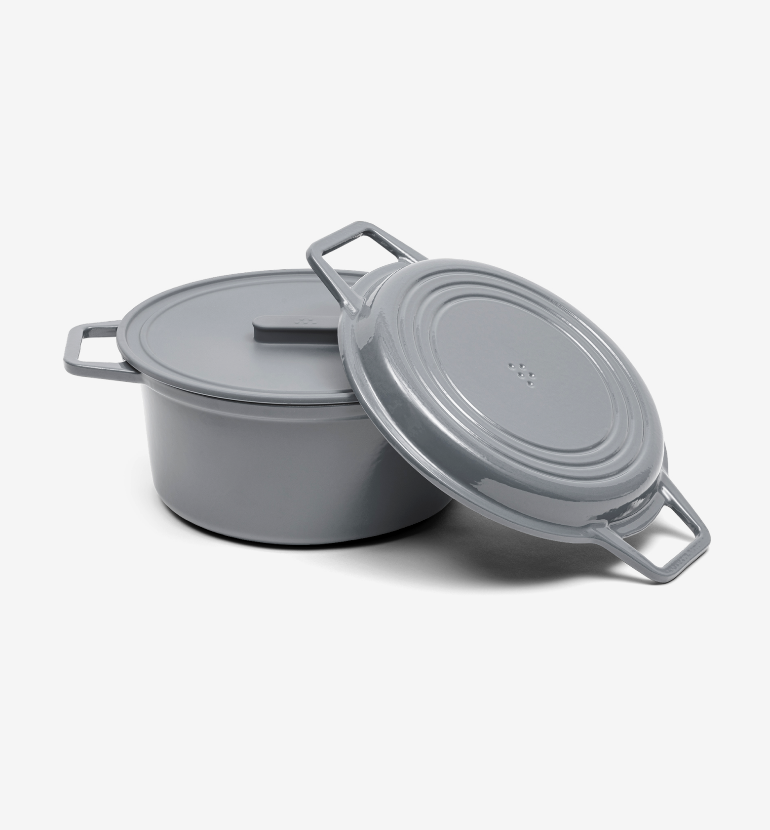 Gray enameled cast iron Dutch oven with lid leaning against pot